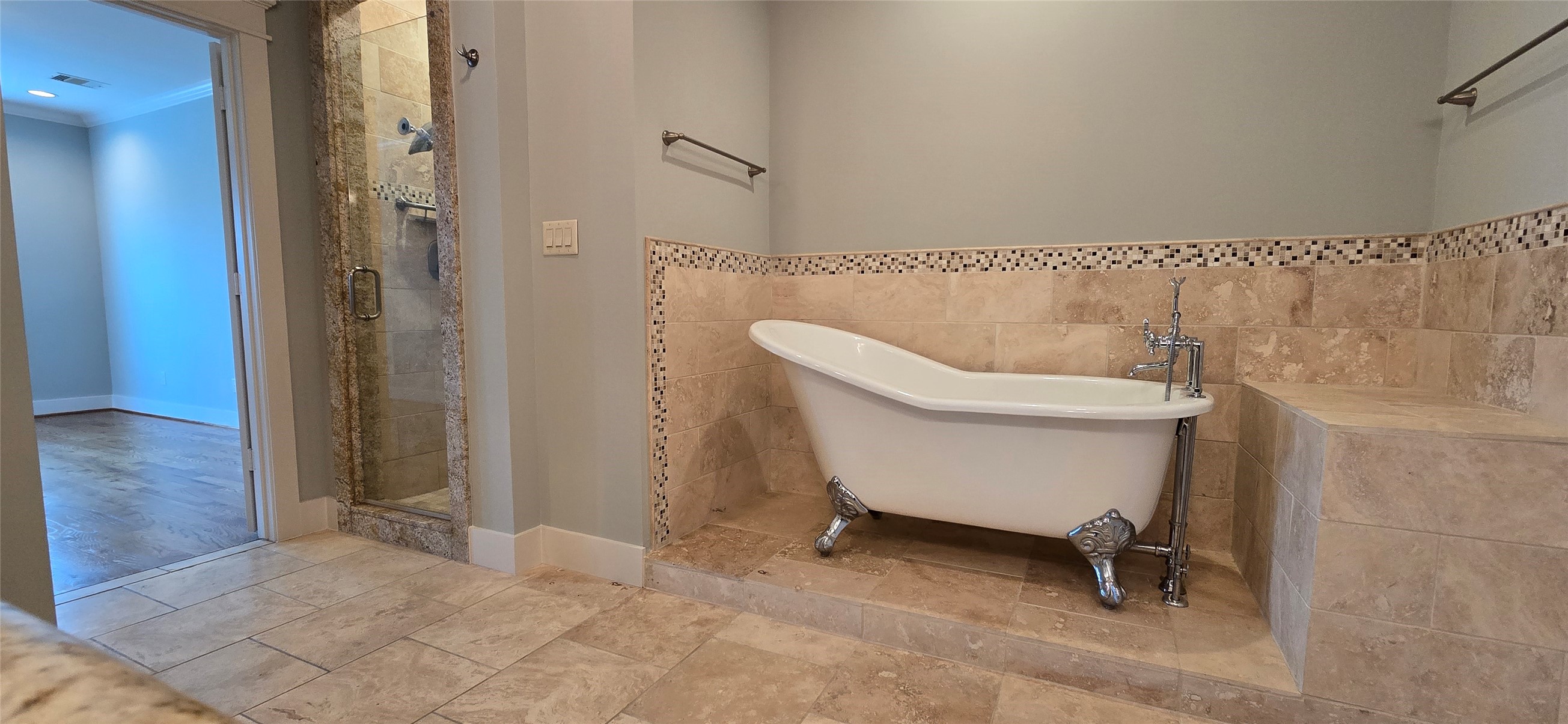 1117 Bonner Street Houston, TX 77007 - Photo 36 of 44 The primary bathroom offers a luxurious spa-like experience with a glass door walk-in shower and a separate clawfoot soaking tub.