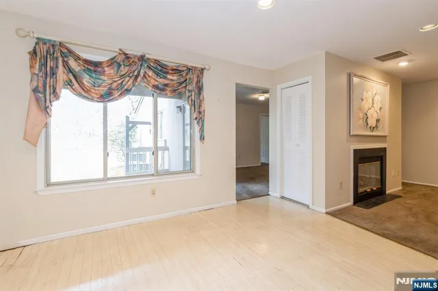 a view of a kitchen cabinets and stainless steel appliances
