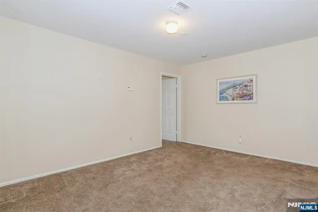 an empty room with closet area