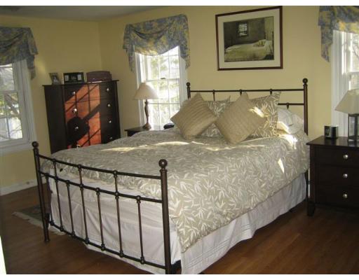 2 Rangeley Ridge Winchester, MA 01890 - Photo 8 of 18 a bed sitting in a bedroom next to a window
