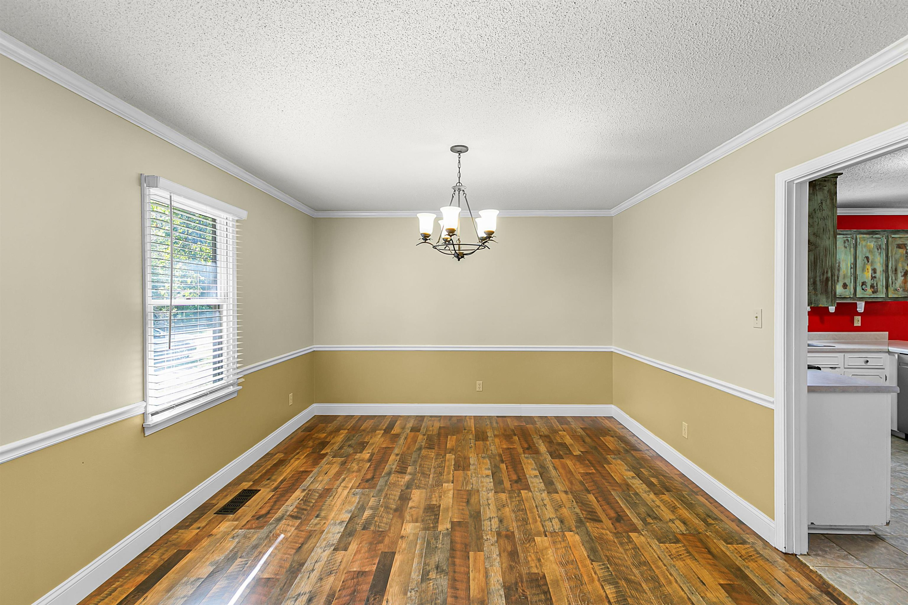 30 Hopewell Church Road Lavinia, TN 38348 - Photo 5 of 31 wooden floor in an empty room with a window