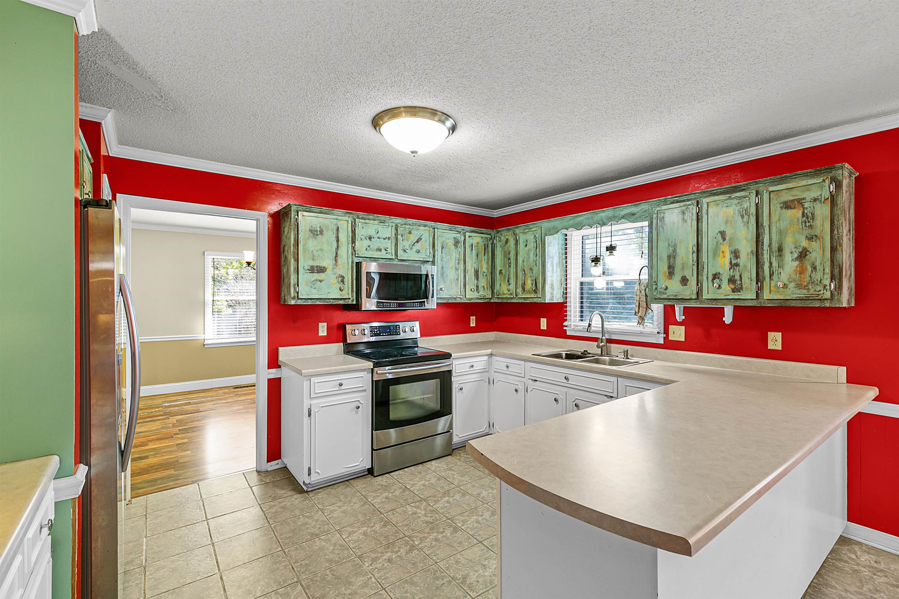 30 Hopewell Church Road Lavinia, TN 38348 - Photo 8 of 31 a kitchen that has a sink and a stove