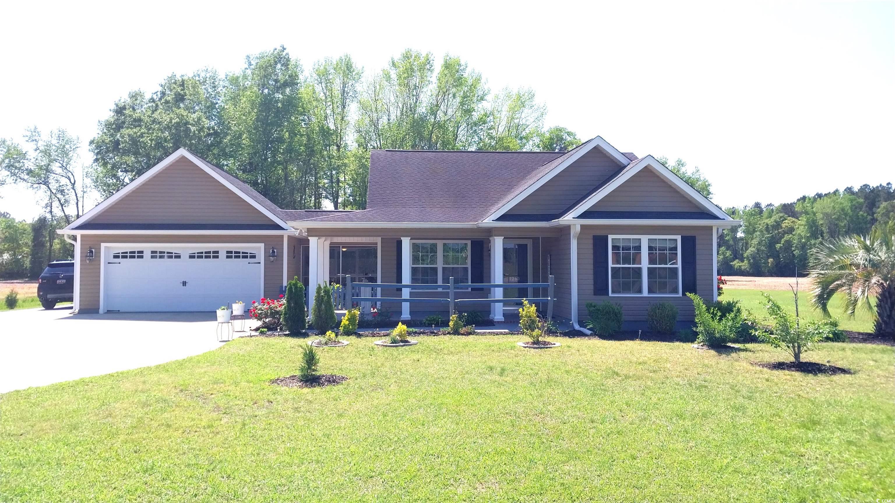 1210 Horry Road Aynor, SC 29511 - Photo 1 of 34 View of front facade featuring a porch, an attache