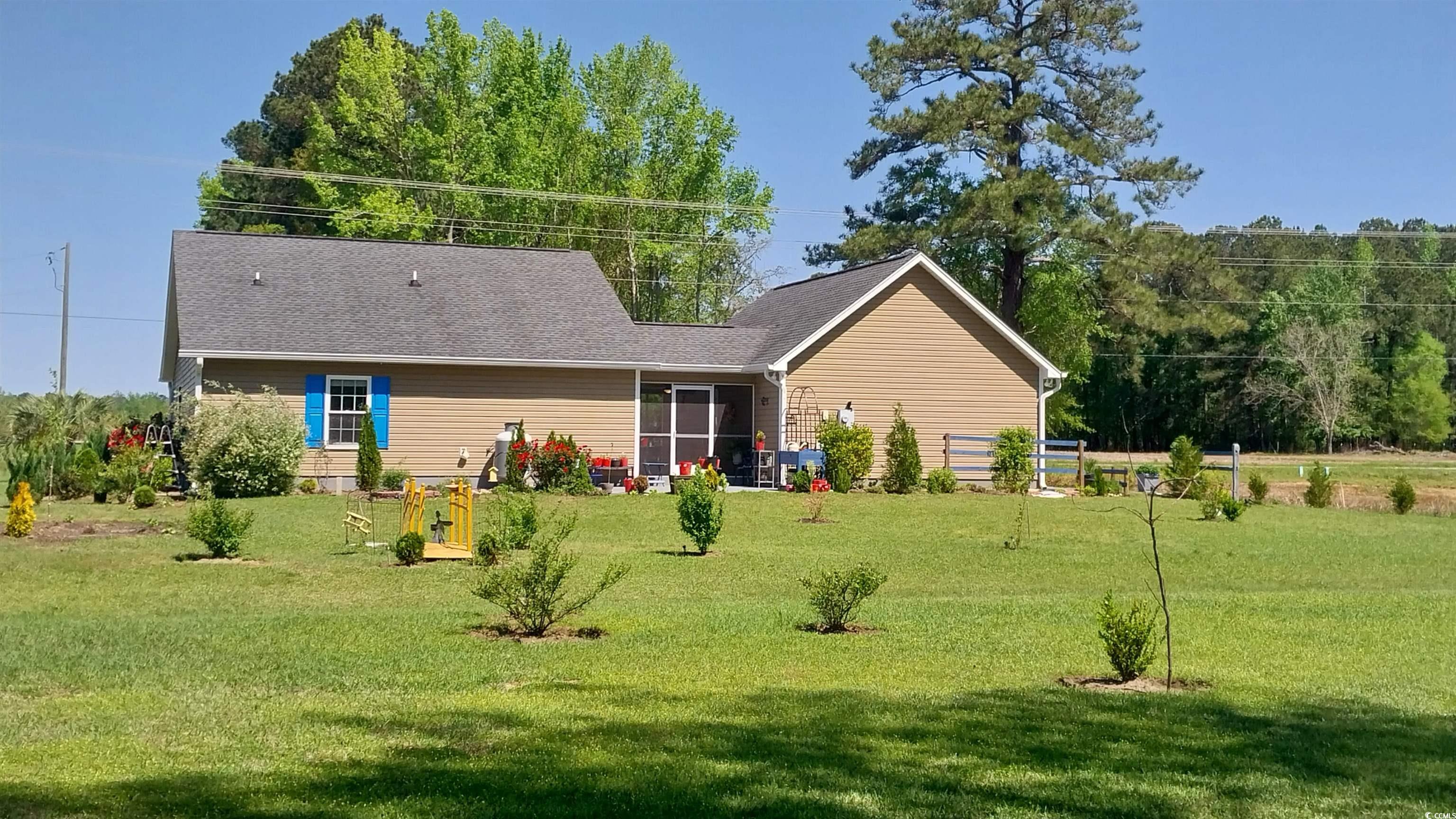 1210 Horry Road Aynor, SC 29511 - Photo 27 of 34 Back of property featuring a shingled roof and a l
