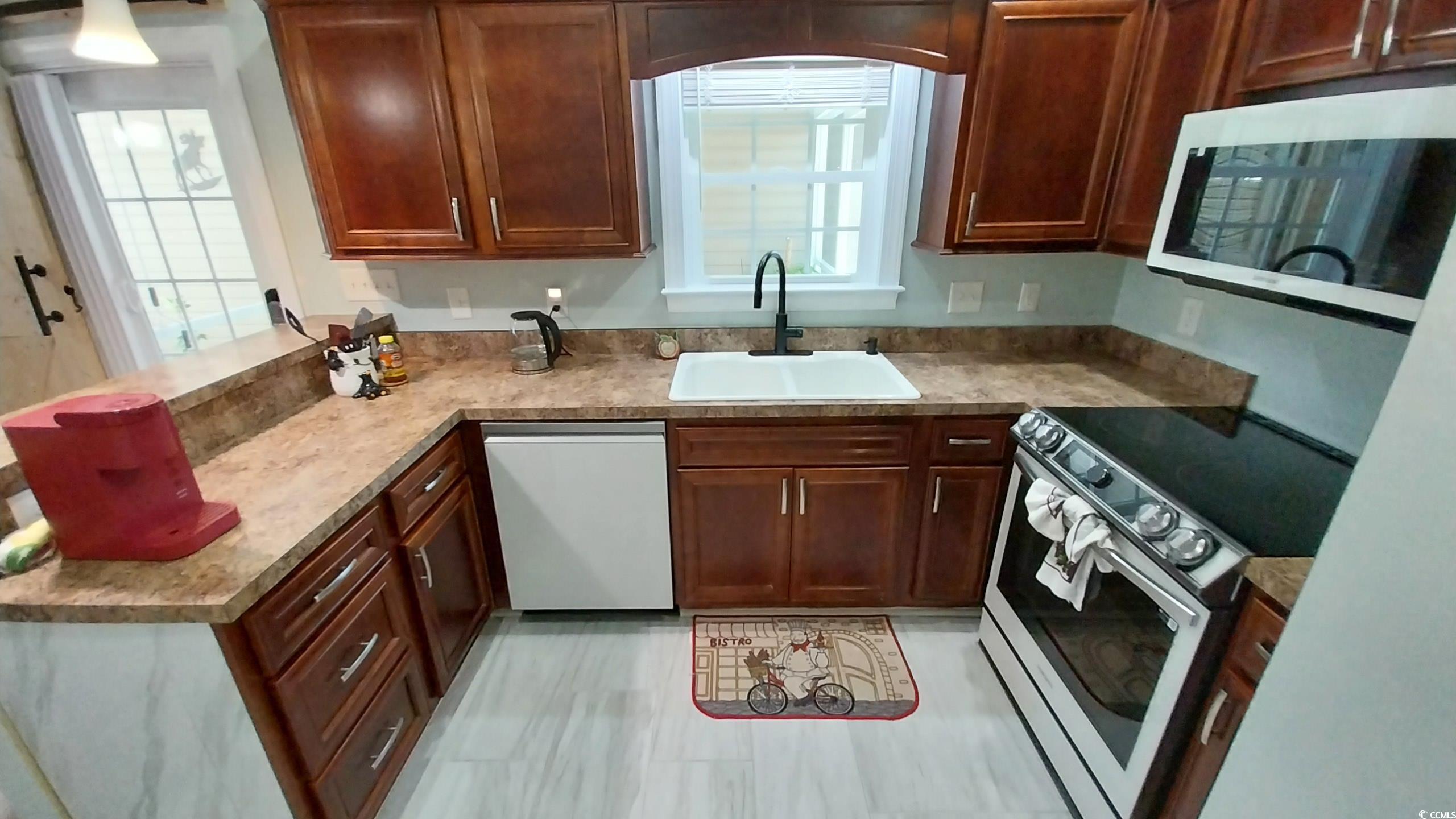 1210 Horry Road Aynor, SC 29511 - Photo 6 of 34 Kitchen with a sink, light countertops, white appl