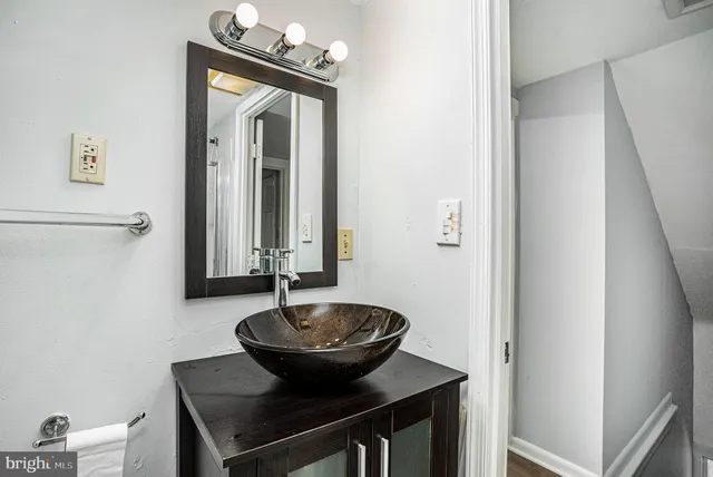 a bathroom with a sink and a mirror