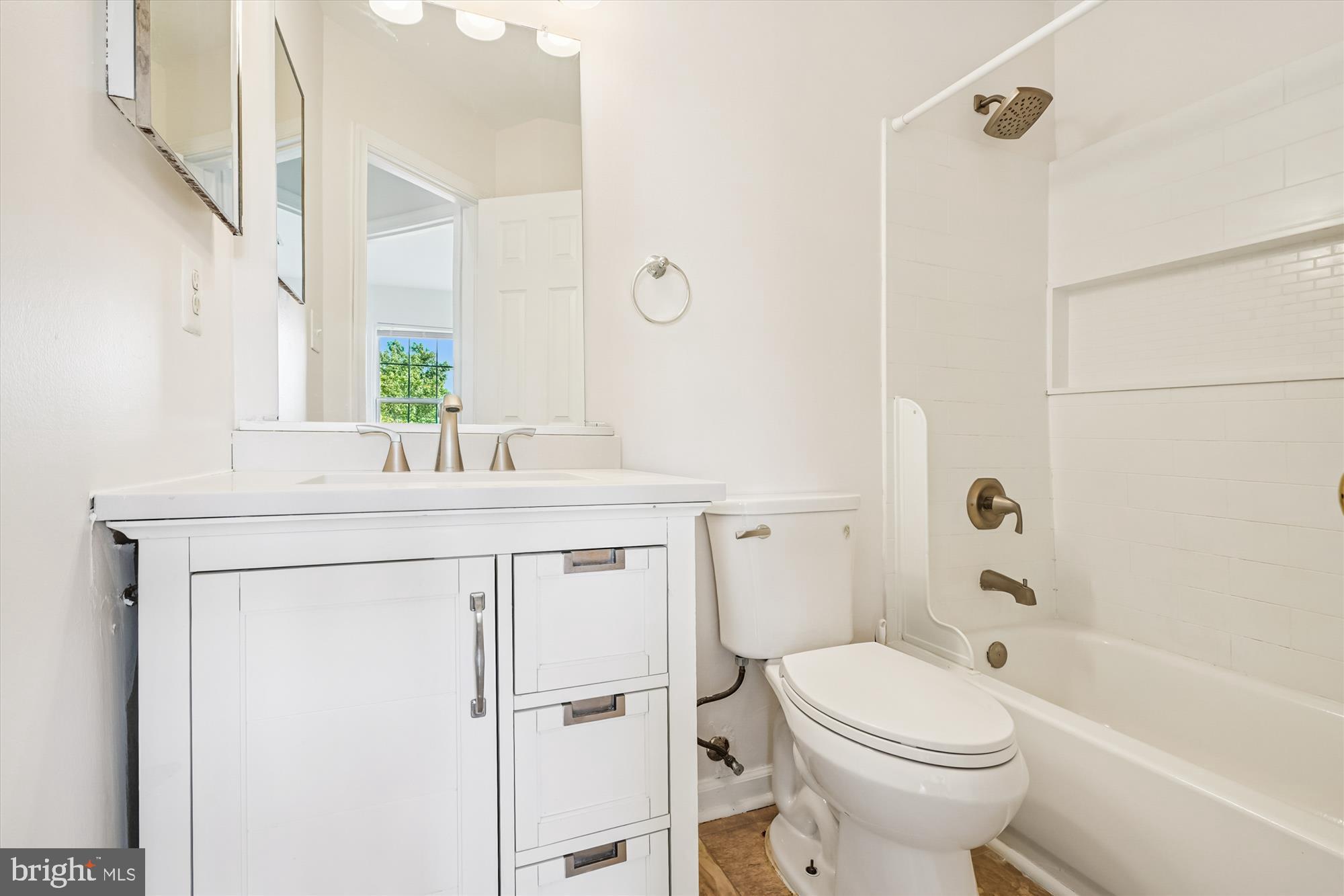 3281 Gina Place Woodbridge, VA 22193 - Photo 14 of 27 a bathroom with a sink toilet vanity and shower
