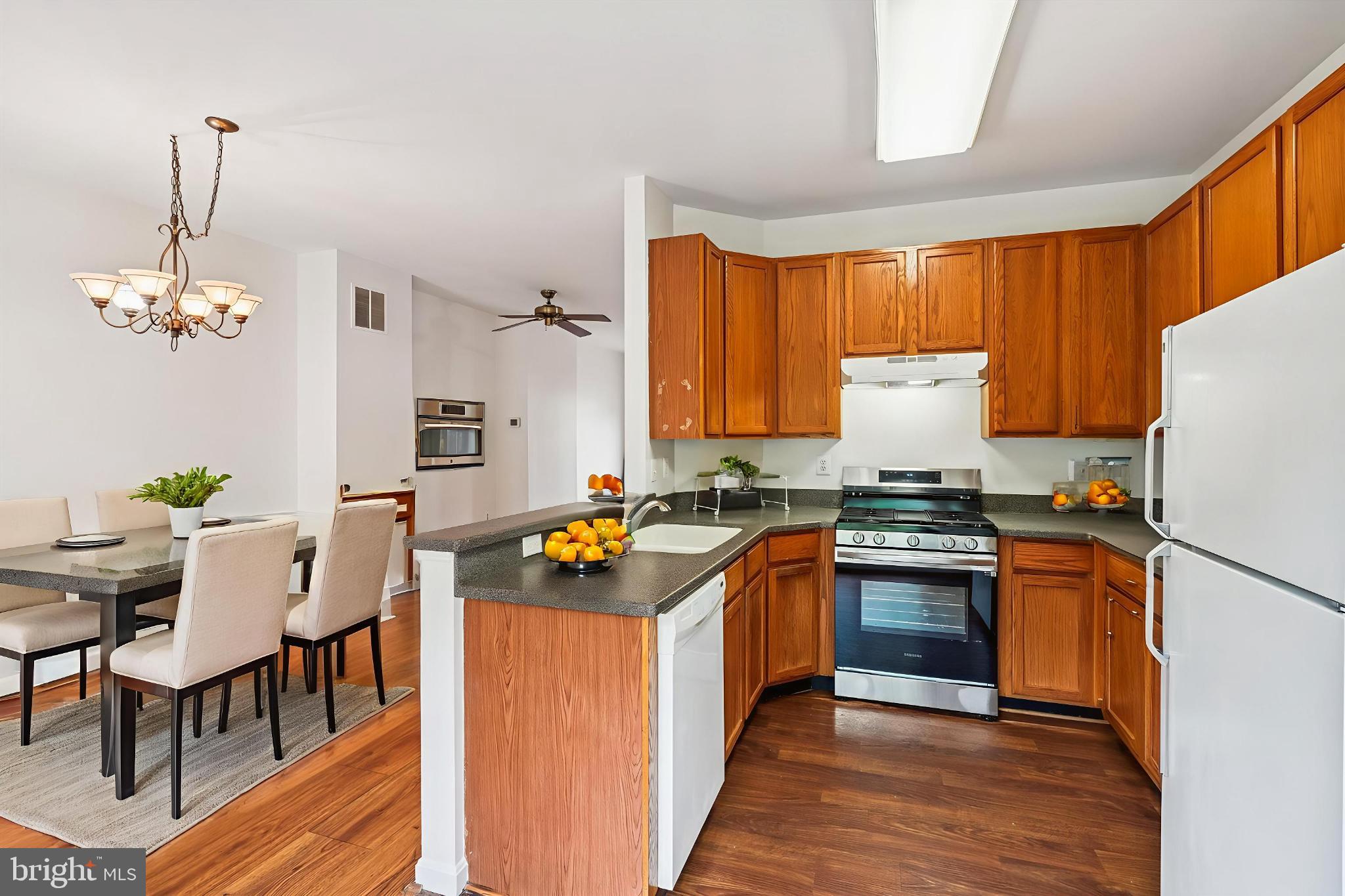 3281 Gina Place Woodbridge, VA 22193 - Photo 4 of 27 a kitchen with stainless steel appliances granite countertop a sink stove and refrigerator