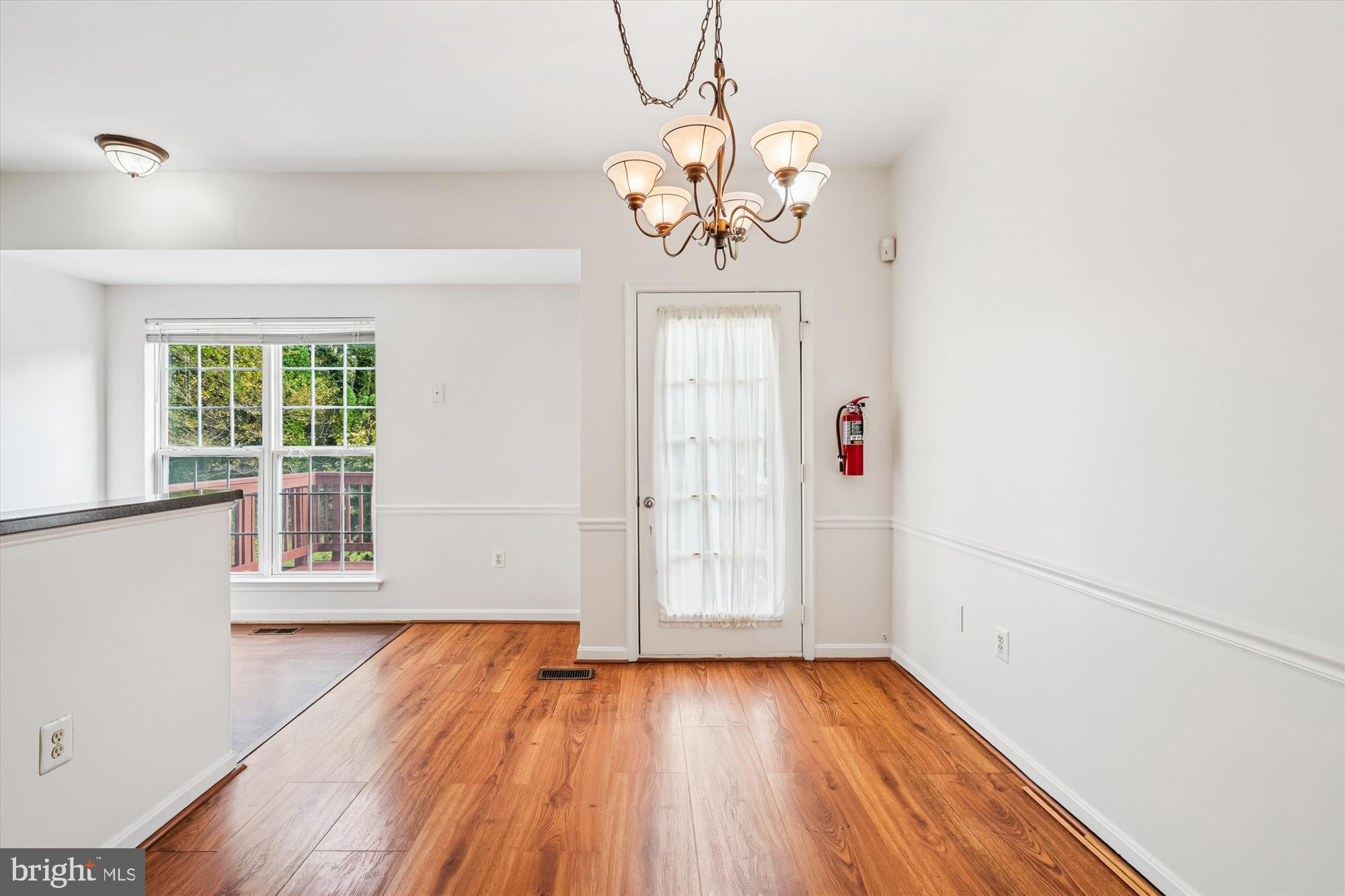 3281 Gina Place Woodbridge, VA 22193 - Photo 5 of 27 a view of an empty room with wooden floor and a window