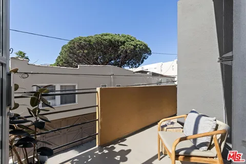 a view of balcony with furniture