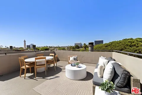 a view of a terrace with furniture
