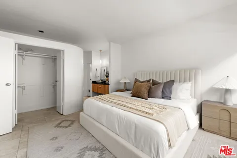 a bed room with a bed and a couch