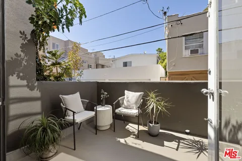 a picture of a table and chairs in the patio