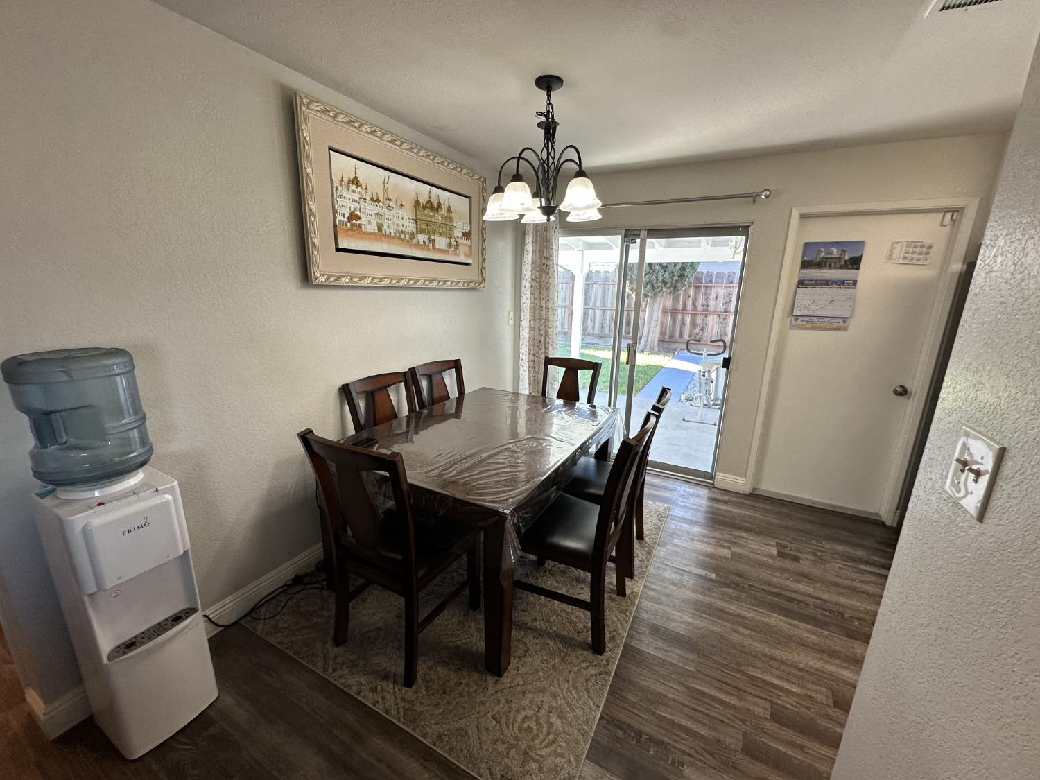 2160 Georgia Way Turlock, CA 95382 - Photo 19 of 25 a view of a dining room with furniture window and wooden floor