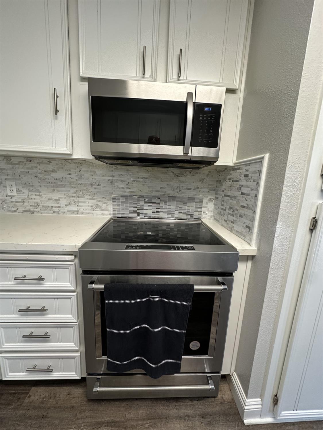 2160 Georgia Way Turlock, CA 95382 - Photo 21 of 25 a stove top oven sitting inside of a kitchen