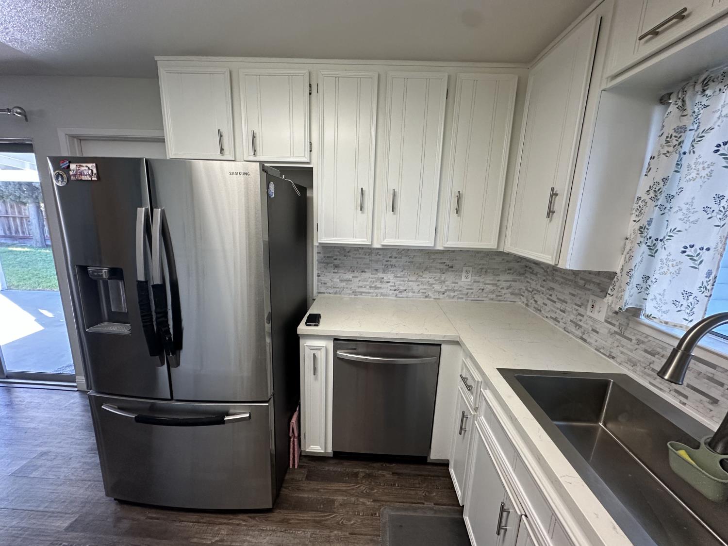 2160 Georgia Way Turlock, CA 95382 - Photo 22 of 25 a kitchen with stainless steel appliances granite countertop a refrigerator a stove a sink and a granite counter tops