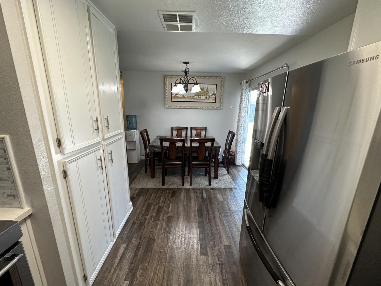 2160 Georgia Way Turlock, CA 95382 - Photo 23 of 25 a view of a livingroom with furniture window and wooden floor