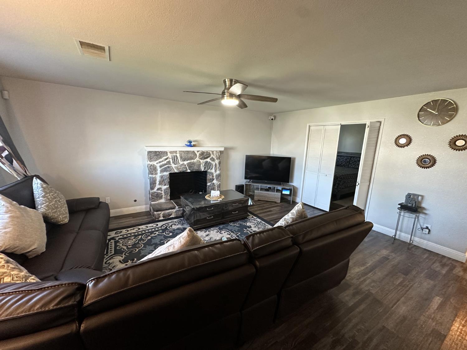 2160 Georgia Way Turlock, CA 95382 - Photo 4 of 25 a living room with furniture and a flat screen tv