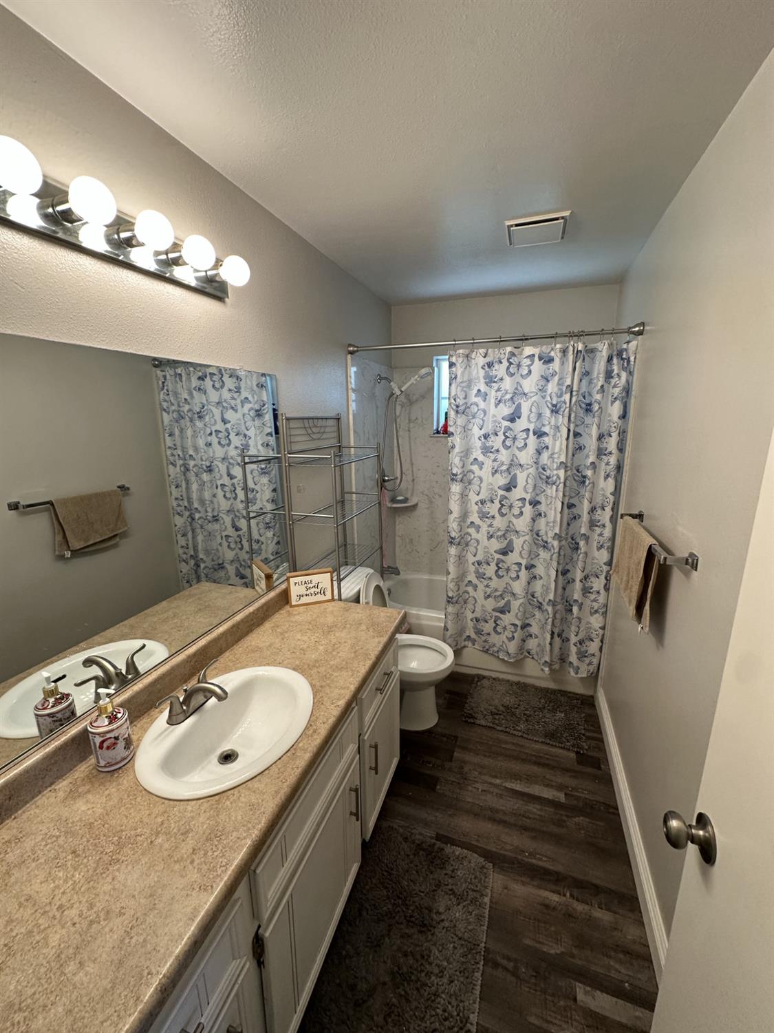 2160 Georgia Way Turlock, CA 95382 - Photo 6 of 25 a bathroom with a sink double vanity and a shower