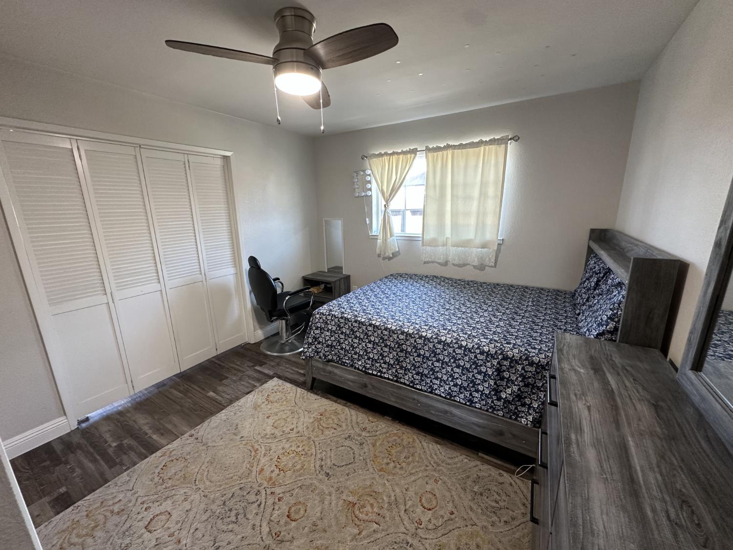 2160 Georgia Way Turlock, CA 95382 - Photo 9 of 25 a bedroom with a bed and wooden floor