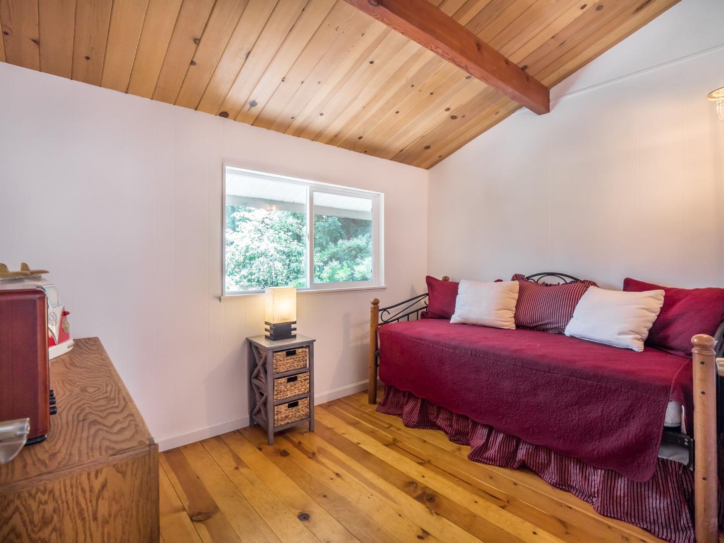 10270 Alba Road Ben Lomond, CA 95005 - Photo 13 of 41 a bedroom with a bed and a window