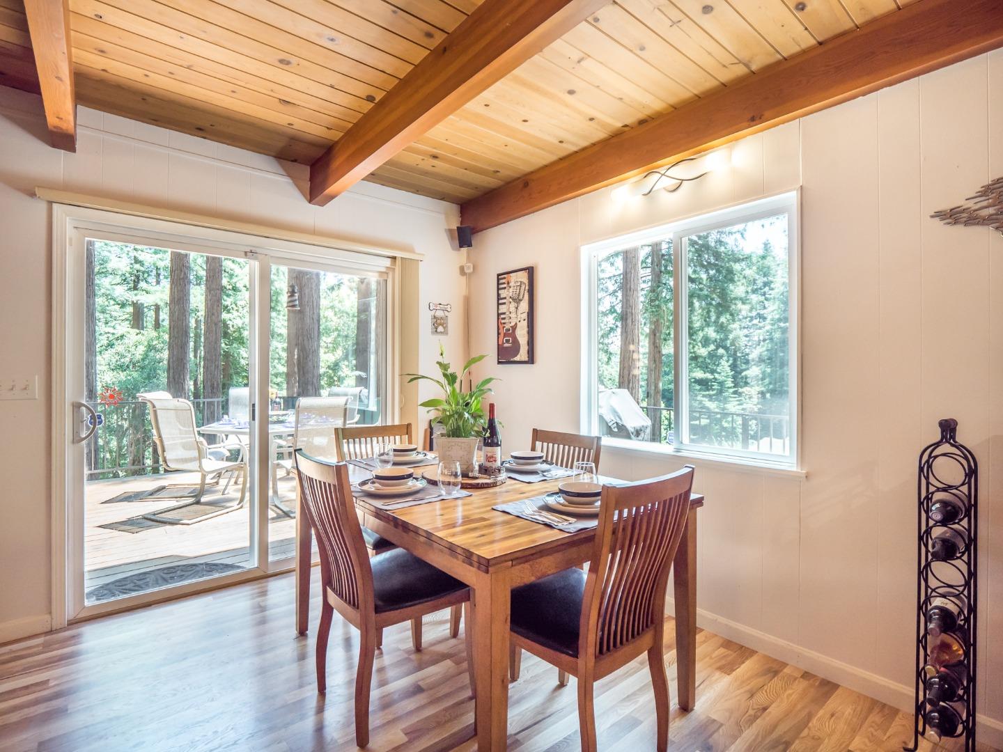 10270 Alba Road Ben Lomond, CA 95005 - Photo 28 of 41 a view of a dining room with furniture wooden floor and chandelier