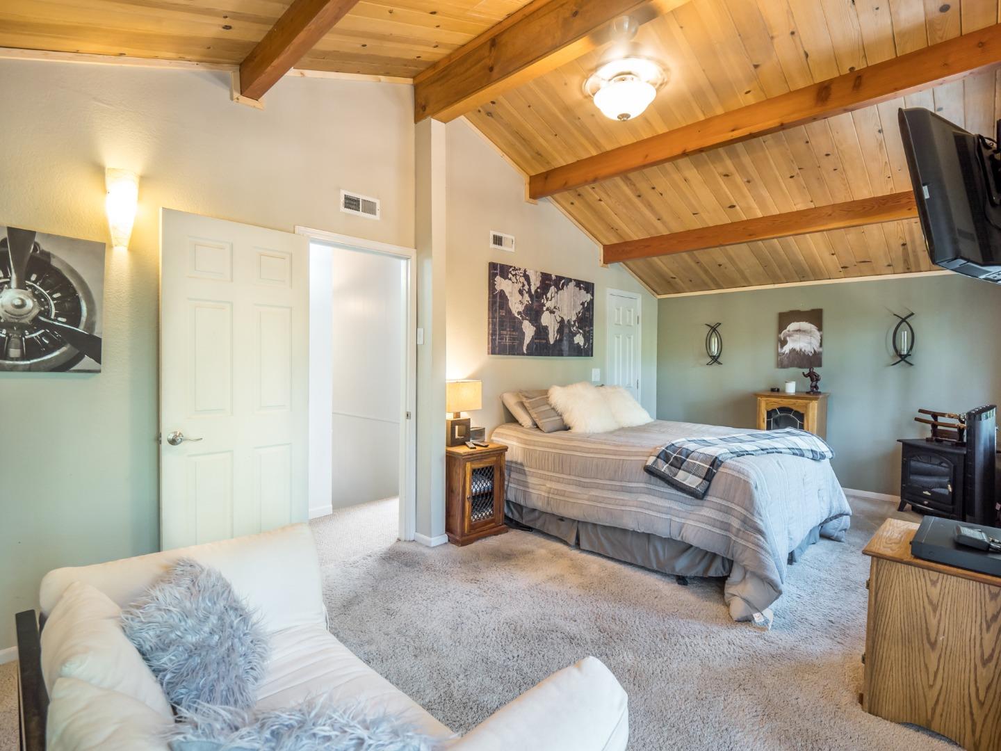 10270 Alba Road Ben Lomond, CA 95005 - Photo 36 of 41 a bedroom with a bed and a couch