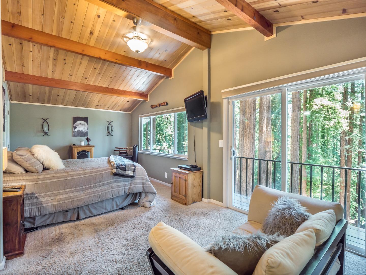 10270 Alba Road Ben Lomond, CA 95005 - Photo 10 of 41 a bedroom with furniture and a large window