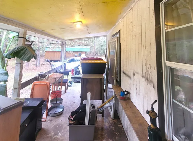 a view of a living room with furniture and a window