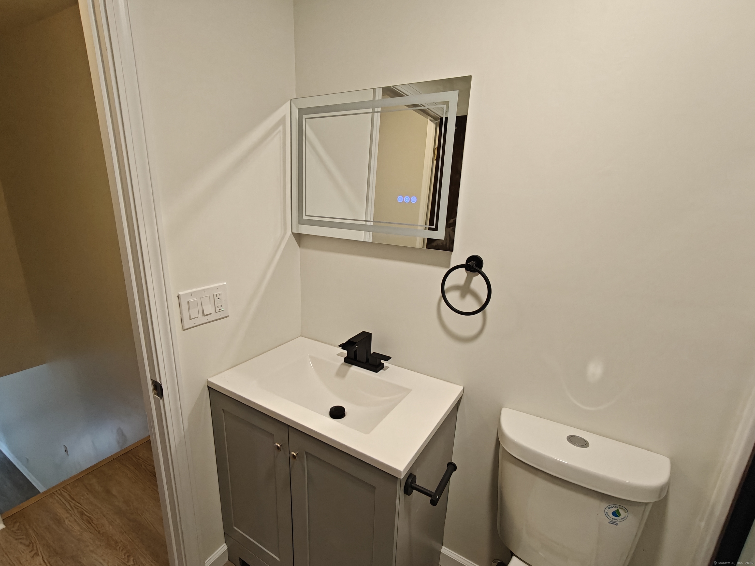 18 Broadview Heights, Unit C Thomaston, CT 06787 - Photo 12 of 15 a bathroom with a sink toilet and mirror