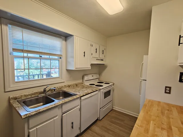 a kitchen that has a sink and a stove