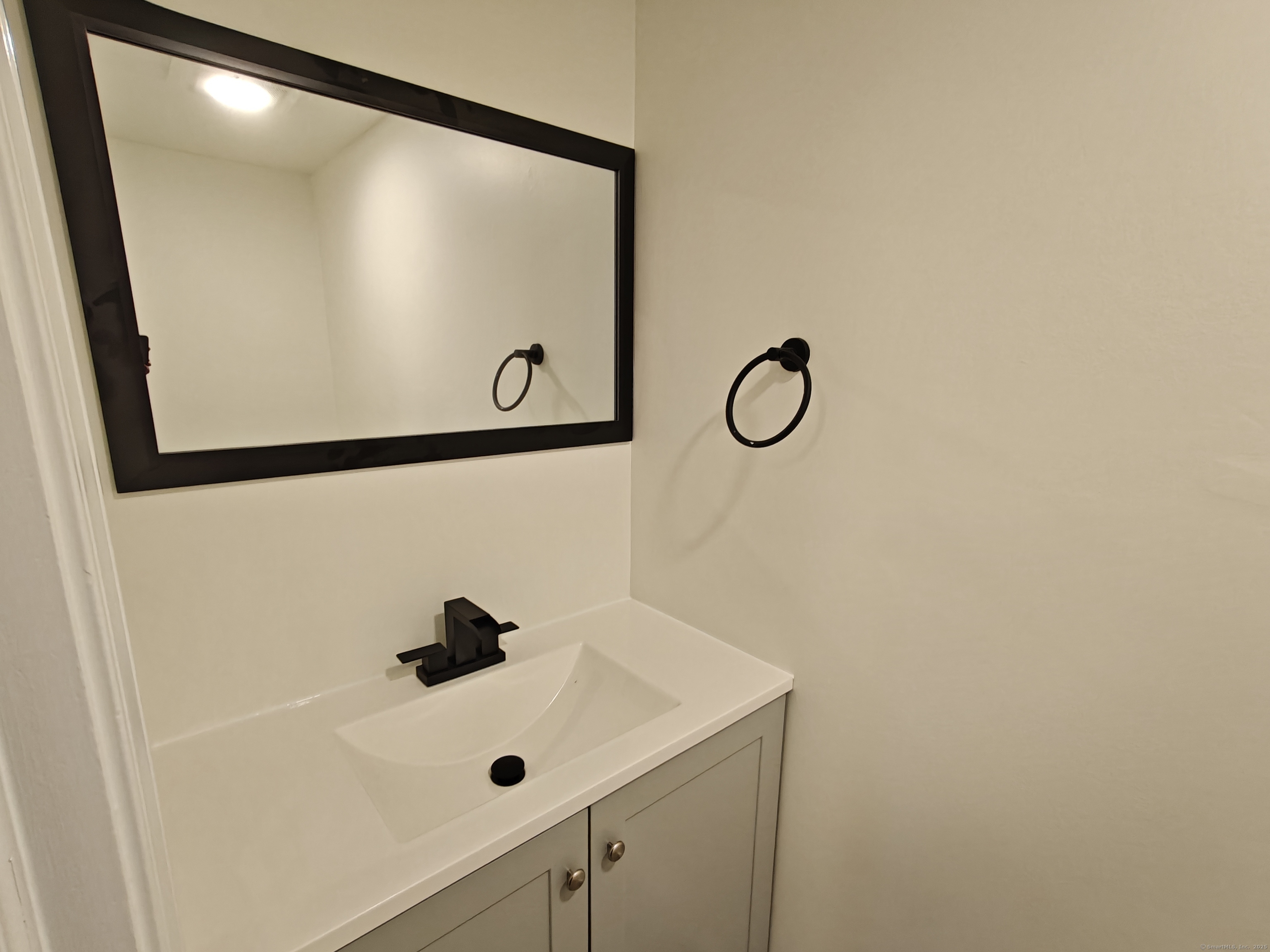 18 Broadview Heights, Unit C Thomaston, CT 06787 - Photo 5 of 15 a bathroom with a shower and mirror