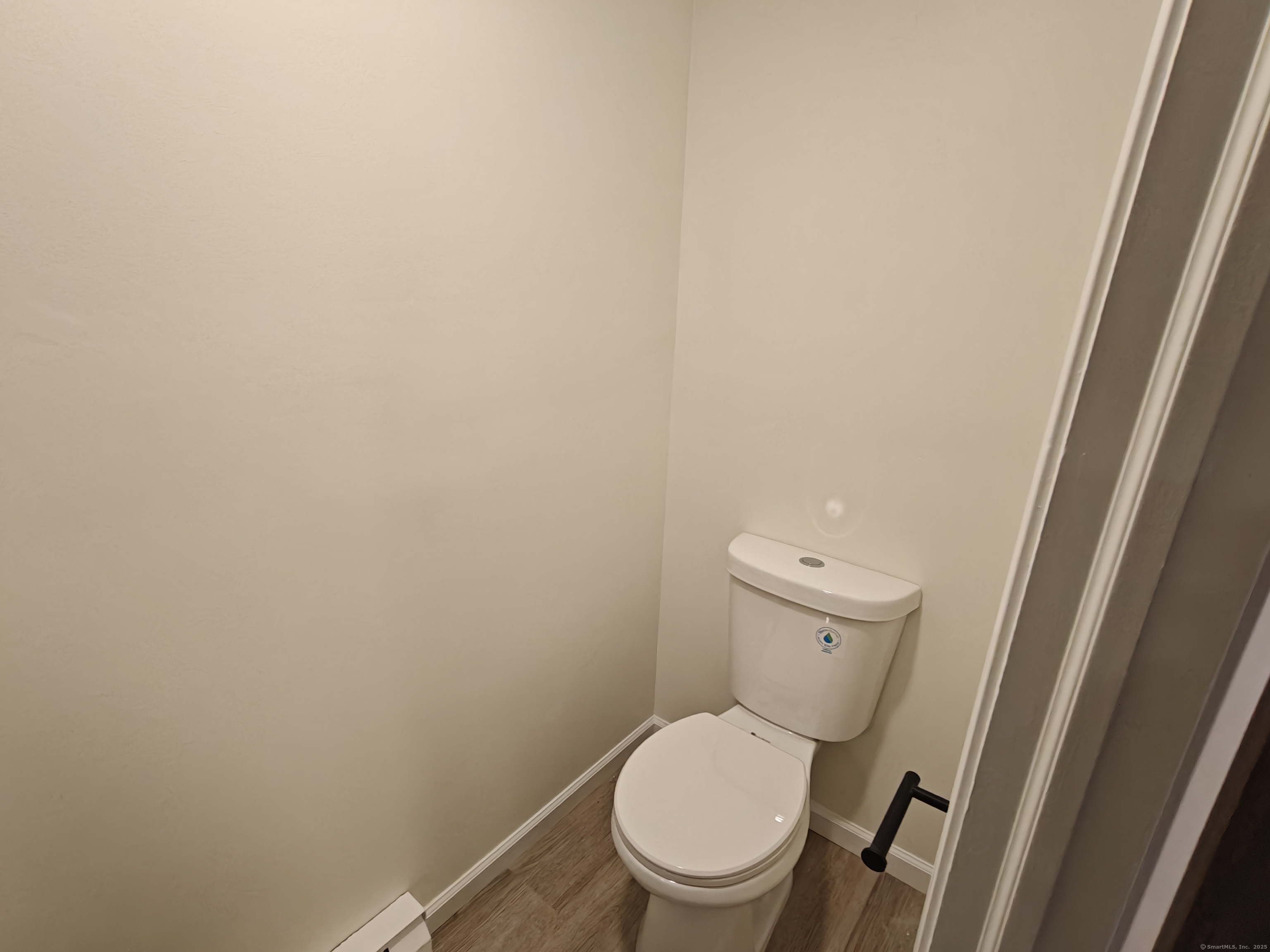 18 Broadview Heights, Unit C Thomaston, CT 06787 - Photo 6 of 15 a white toilet sitting next to a shower