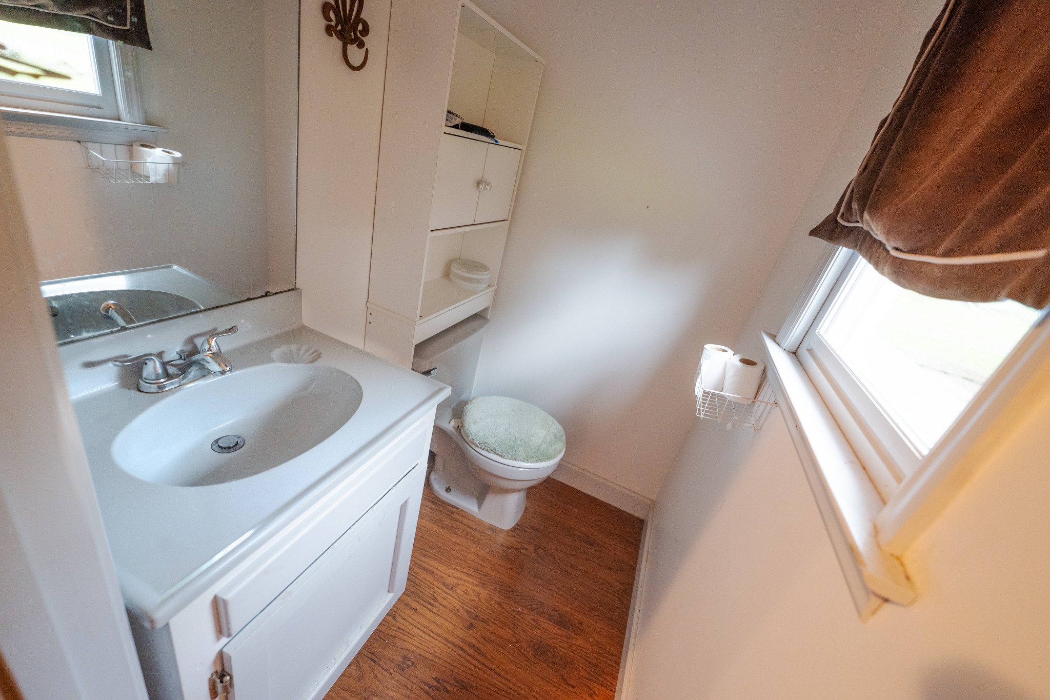 757 Bryson Road Ardmore, TN 38449 - Photo 29 of 40 a bathroom with a sink vanity granite toilet and a mirror