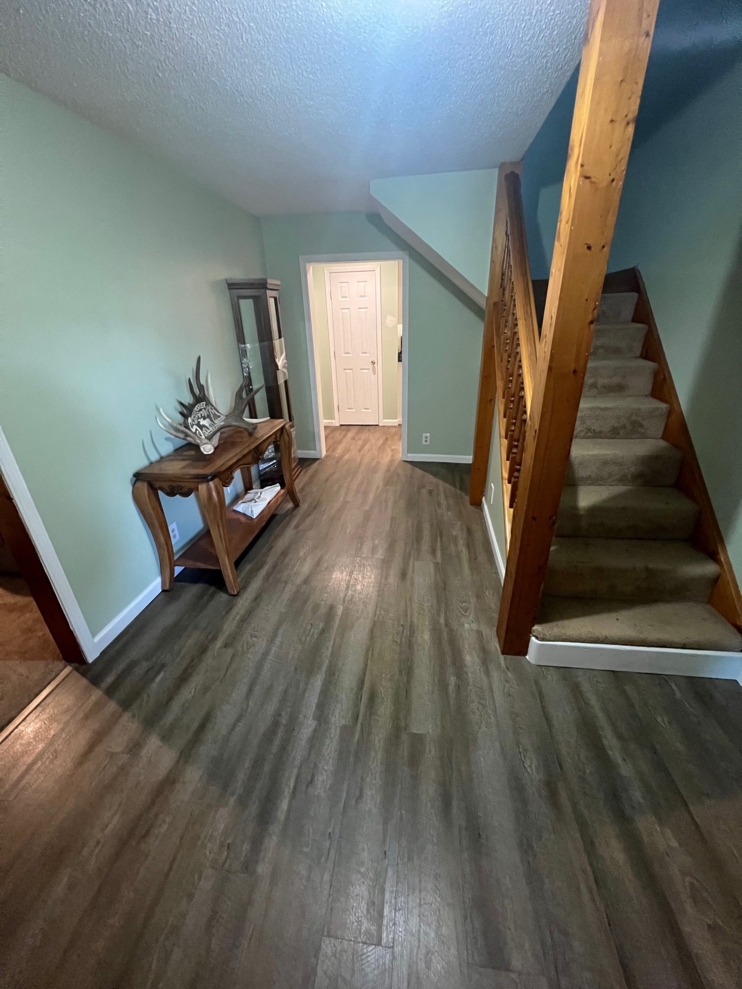 757 Bryson Road Ardmore, TN 38449 - Photo 6 of 40 a view of a livingroom with wooden floor and stairs