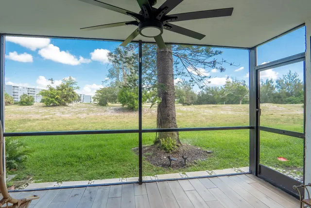 a view of a porch and garden