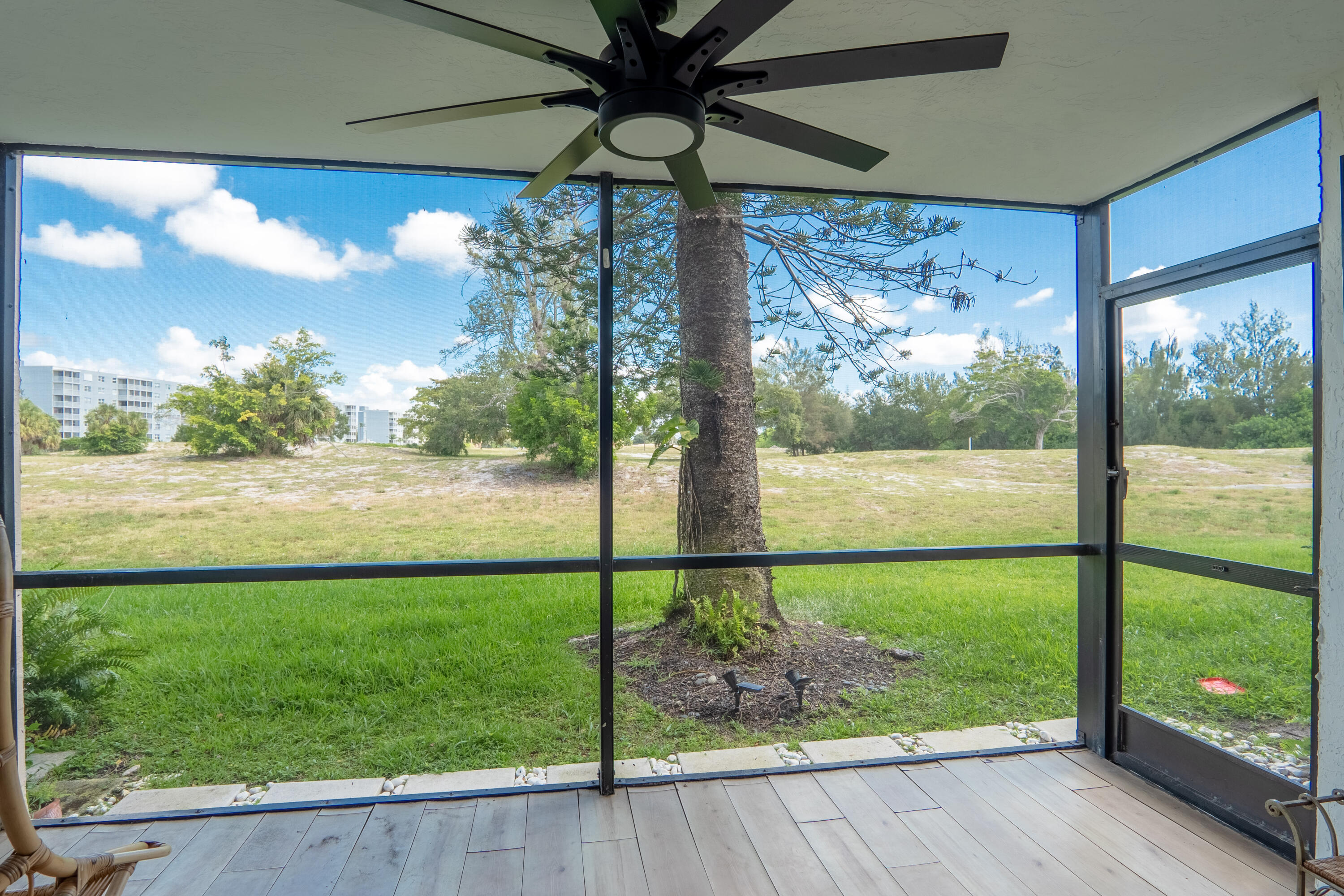 5260 Northwest 2nd Avenue, Unit 105 Boca Raton, FL 33487 - Photo 17 of 24 a view of a porch and garden