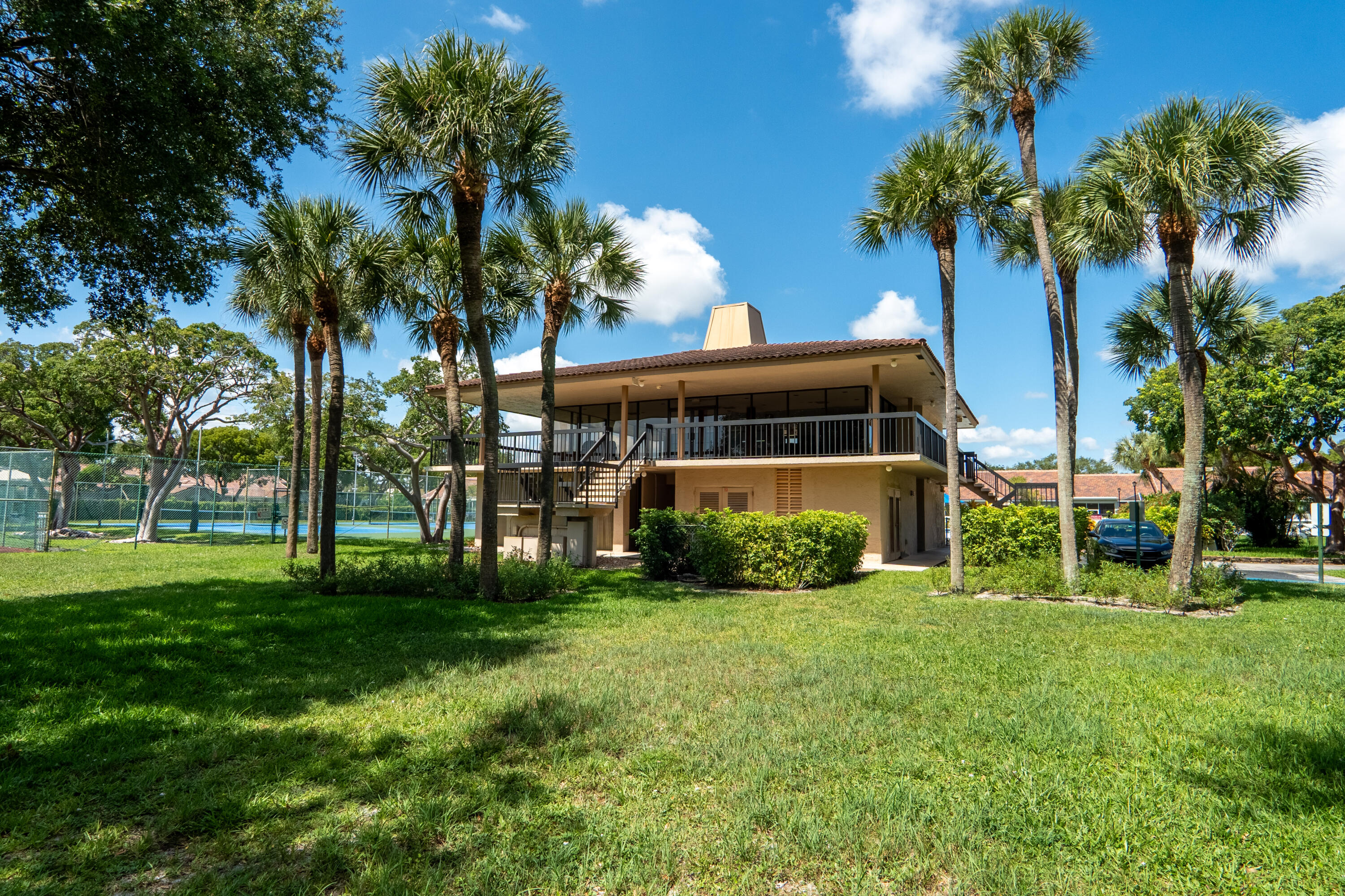 5260 Northwest 2nd Avenue, Unit 105 Boca Raton, FL 33487 - Photo 22 of 24 a view of a house with a yard