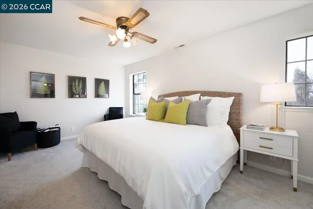 a bedroom with bed and a chandelier