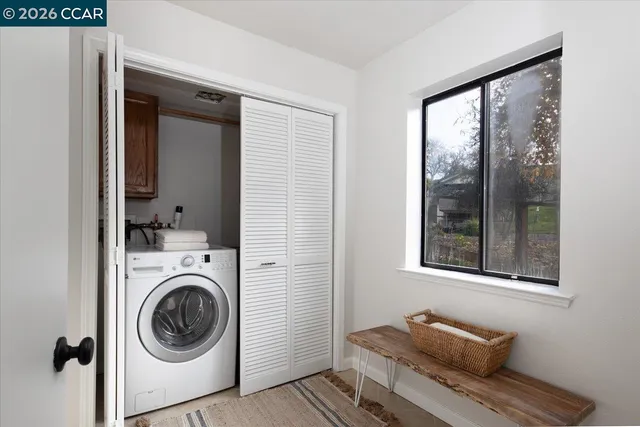 a utility room with dryer and washer