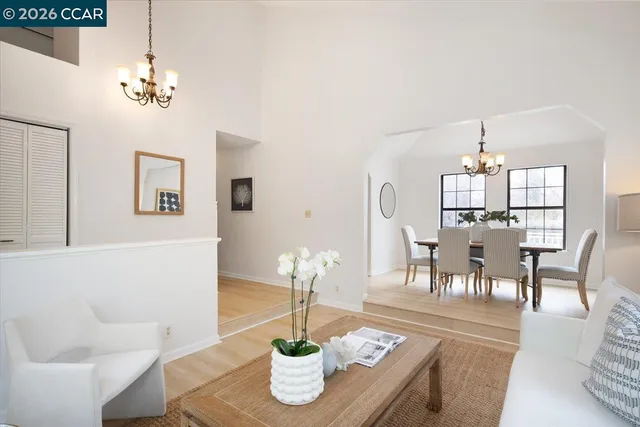 a dining room with wooden table and chairs