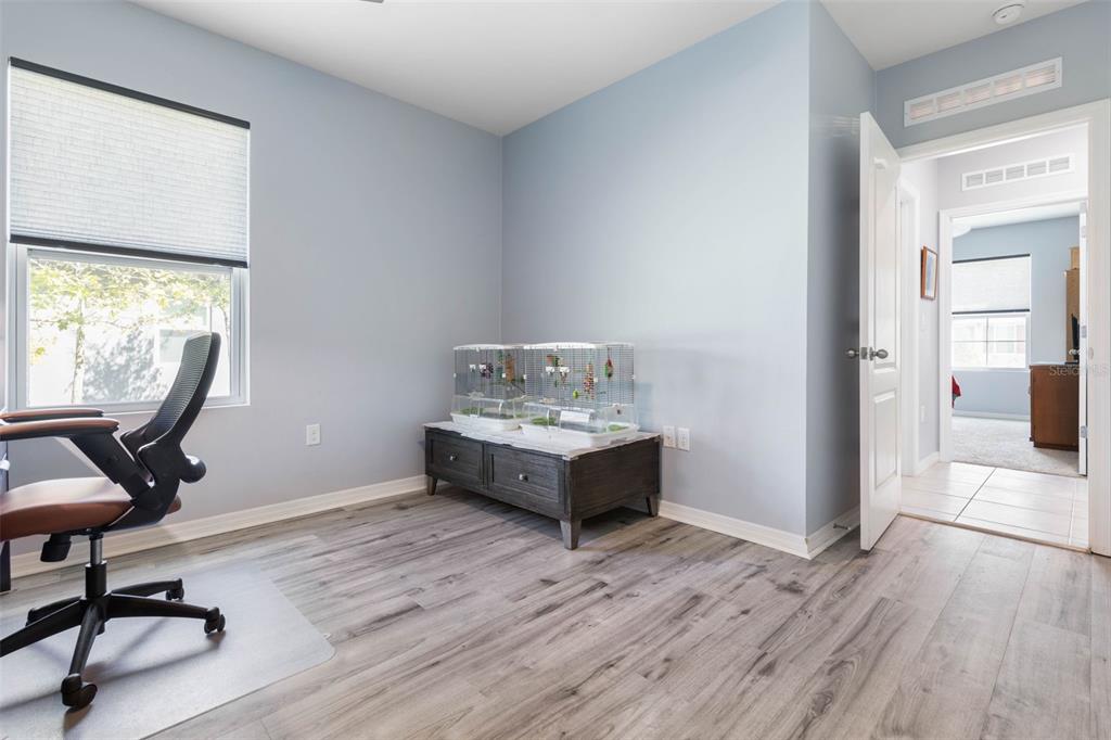 277 Sunset Point Drive Ormond Beach, FL 32174 - Photo 8 of 52 a view of workspace with wooden floor and windows