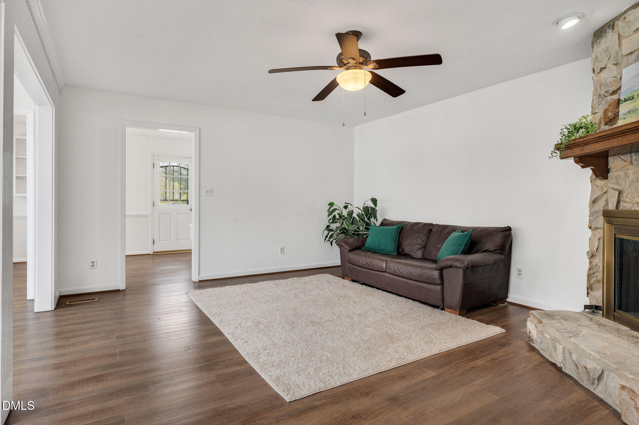 9205 Tree Meadow Lane Raleigh, NC 27603 - Photo 15 of 44 a living room with furniture and a wooden floor
