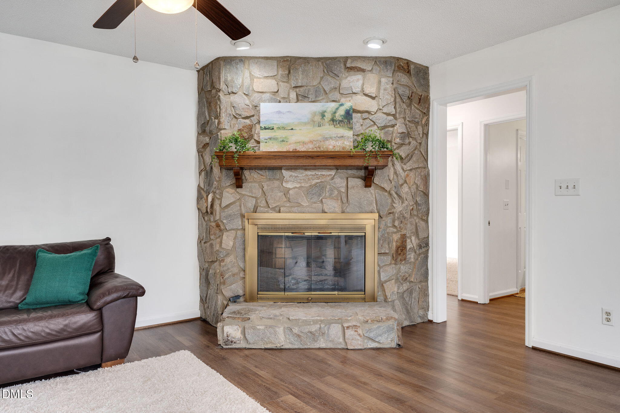 9205 Tree Meadow Lane Raleigh, NC 27603 - Photo 16 of 44 a living room with furniture and a fireplace