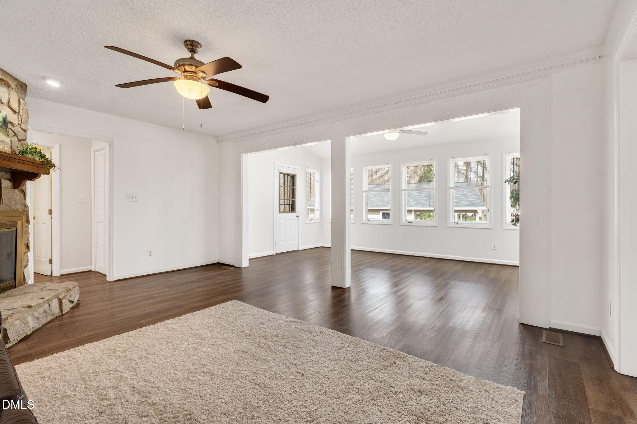 9205 Tree Meadow Lane Raleigh, NC 27603 - Photo 17 of 44 a view of an empty room with window and wooden floor