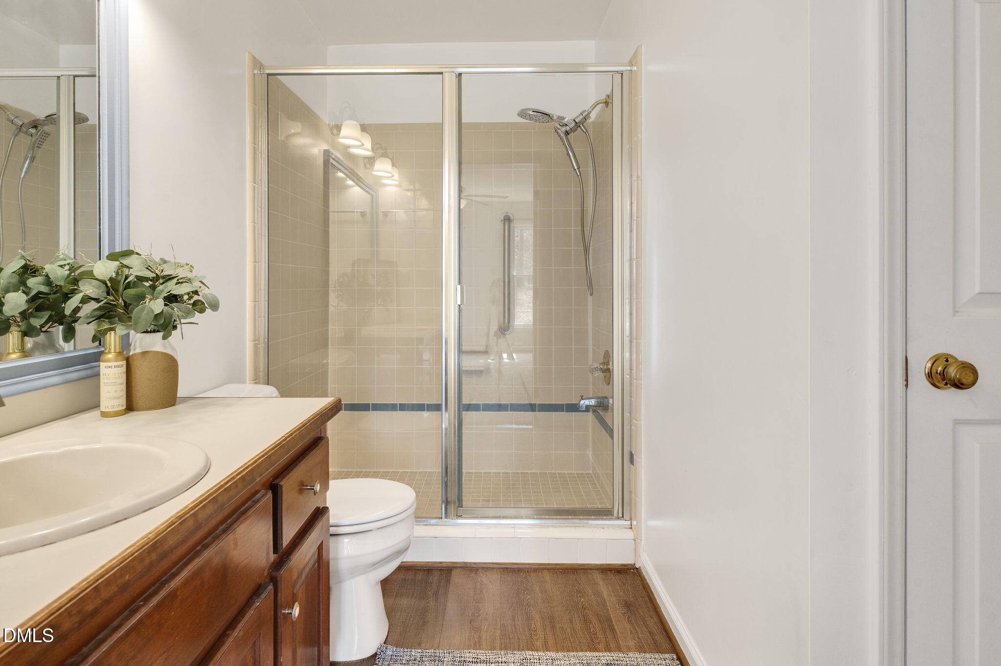 9205 Tree Meadow Lane Raleigh, NC 27603 - Photo 23 of 44 a bathroom with a sink a toilet and shower