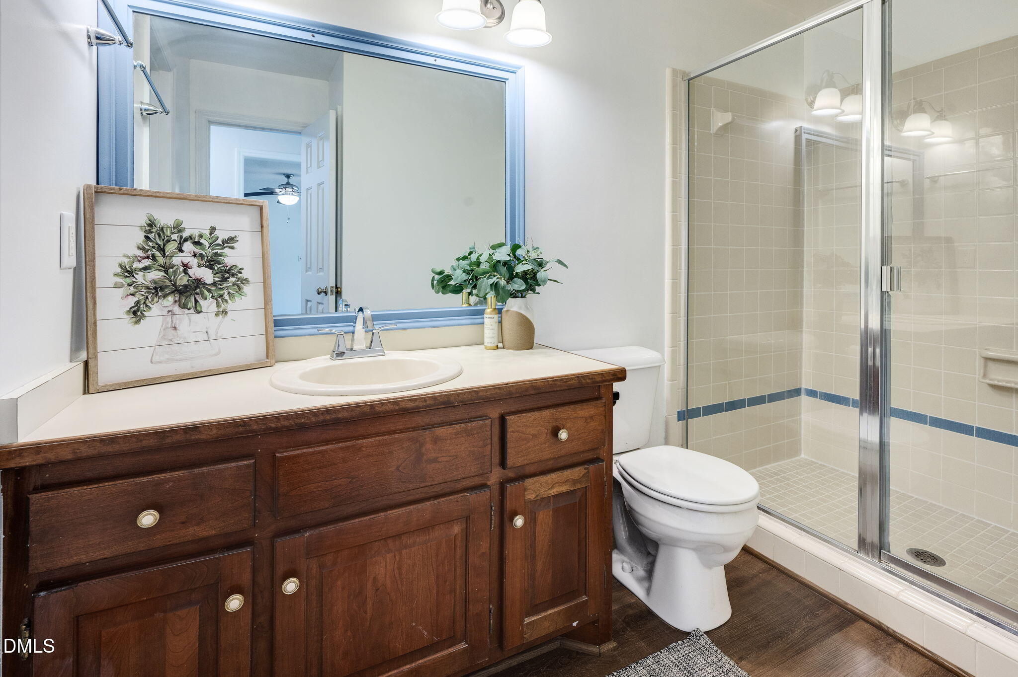 9205 Tree Meadow Lane Raleigh, NC 27603 - Photo 24 of 44 a bathroom with a sink toilet and shower