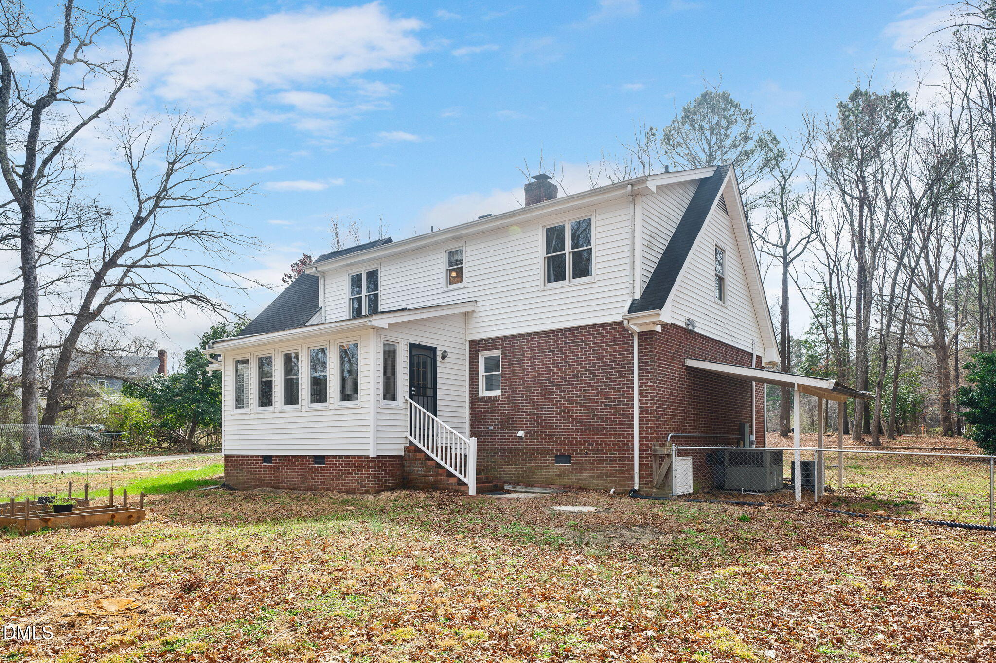9205 Tree Meadow Lane Raleigh, NC 27603 - Photo 35 of 44 a house that has a large tree in front of it