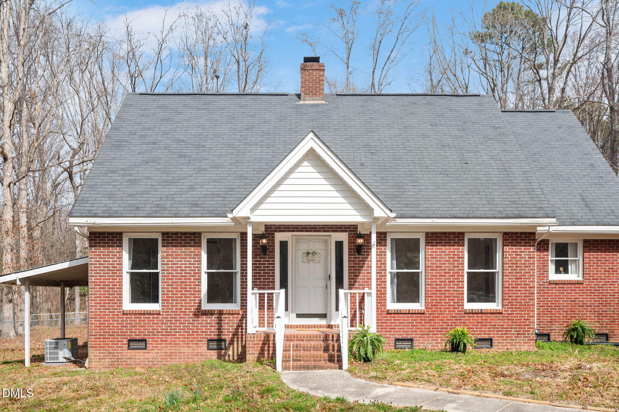 9205 Tree Meadow Lane Raleigh, NC 27603 - Photo 3 of 44 front view of a house with a yard