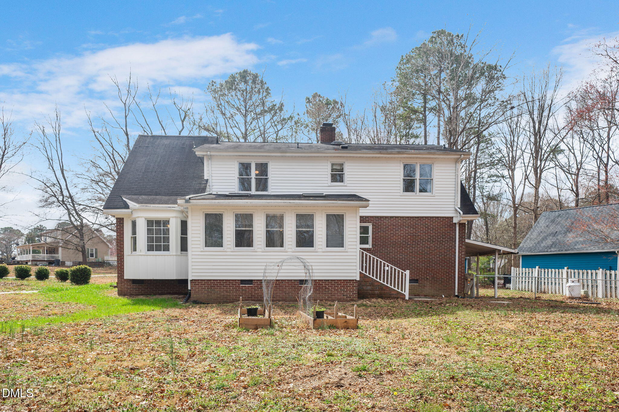 9205 Tree Meadow Lane Raleigh, NC 27603 - Photo 4 of 44 a front view of a house with a yard